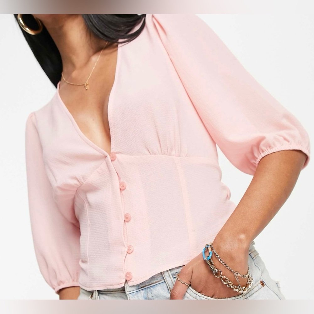 ASOS design button front tea blouse with volume sleeves and tie back detail.